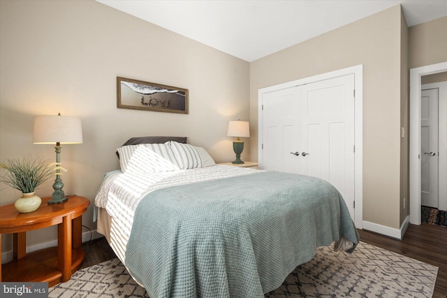 bedroom with a closet and hardwood / wood-style flooring