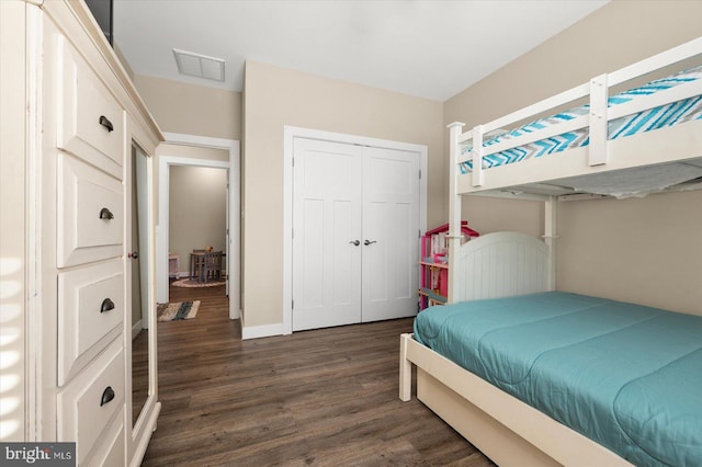 bedroom with a closet and dark wood-type flooring