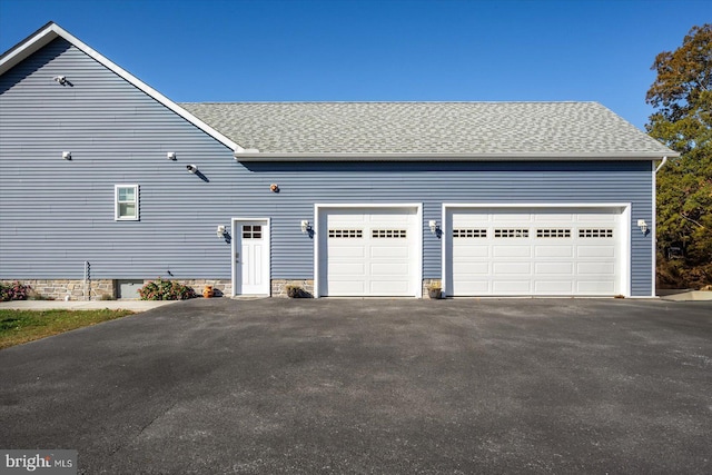 view of property exterior featuring a garage