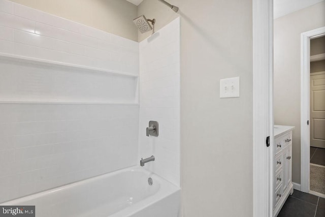 bathroom with bathtub / shower combination, vanity, and tile patterned flooring