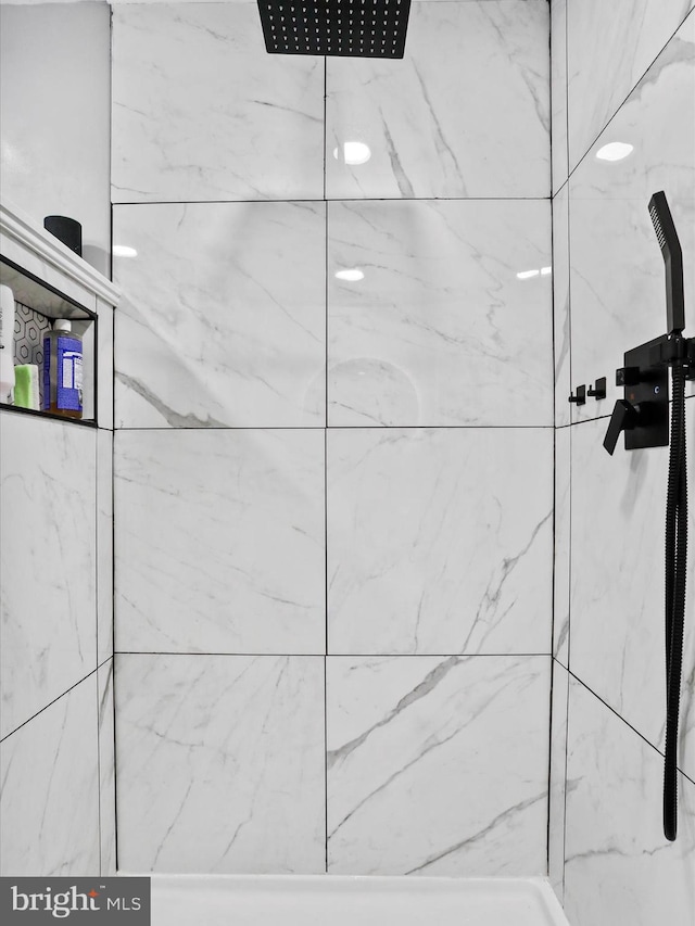 room details with a tile shower