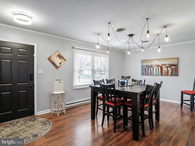 dining room with dark hardwood / wood-style floors, an inviting chandelier, ornamental molding, and a baseboard radiator