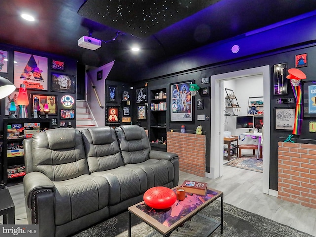 cinema room featuring hardwood / wood-style flooring