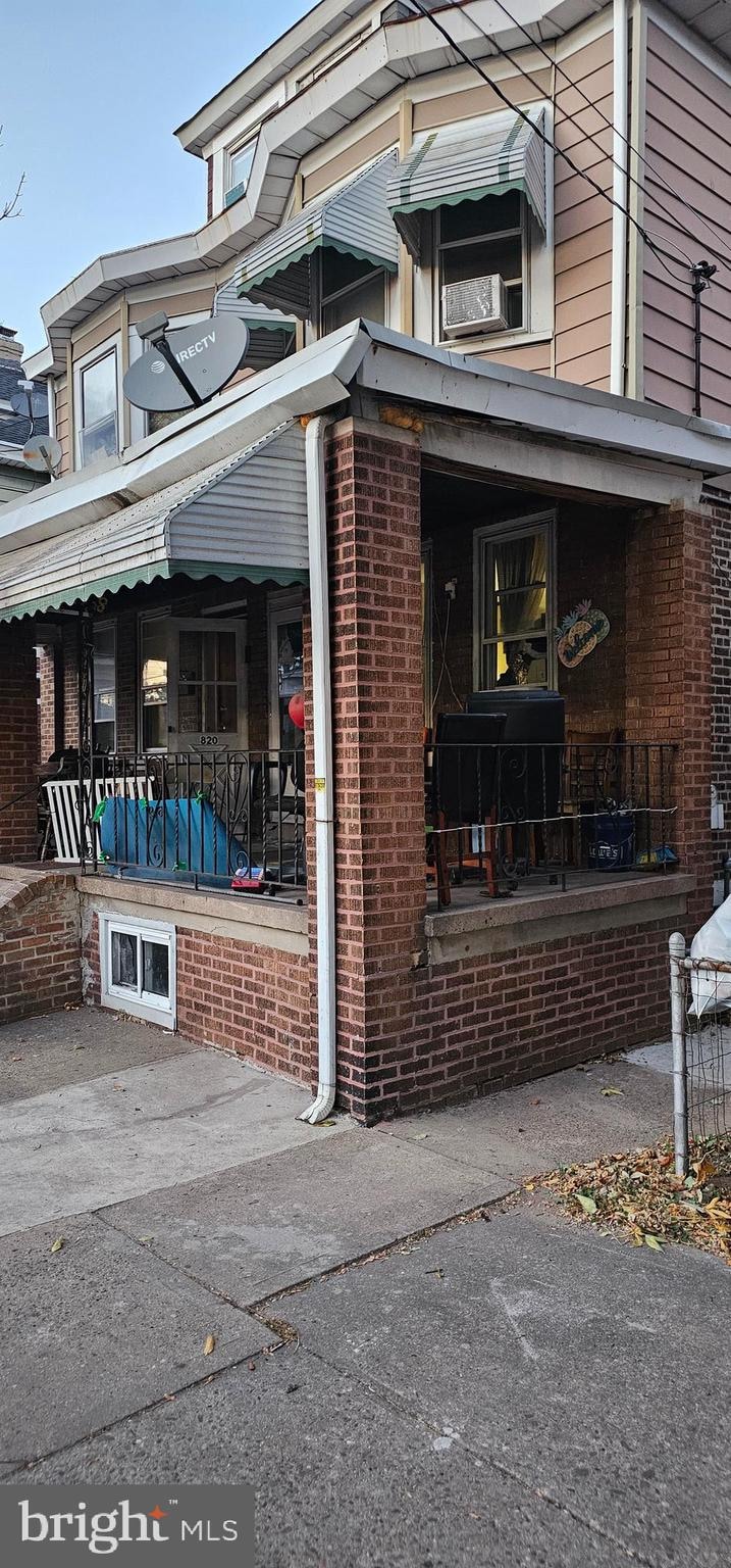 view of property exterior with a porch