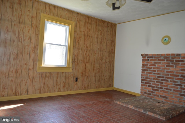 909 Ridge Rd, Westminster, MD 21157 - unfurnished room featuring wooden walls, ceiling fan, brick patterned floor, and baseboards