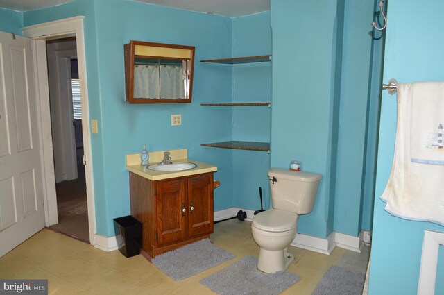 909 Ridge Rd, Westminster, MD 21157 - full bathroom with tile patterned floors, vanity, toilet, and baseboards