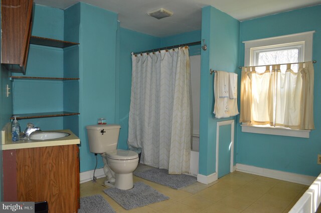 909 Ridge Rd, Westminster, MD 21157 - full bath with toilet, tile patterned flooring, vanity, and baseboards