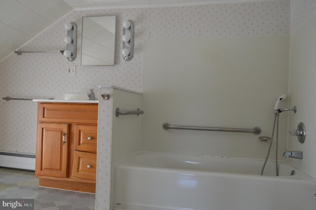 909 Ridge Rd, Westminster, MD 21157 - bathroom with wallpapered walls, a bath, and baseboard heating