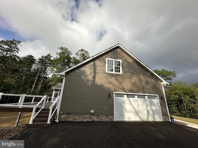 view of side of property with a garage