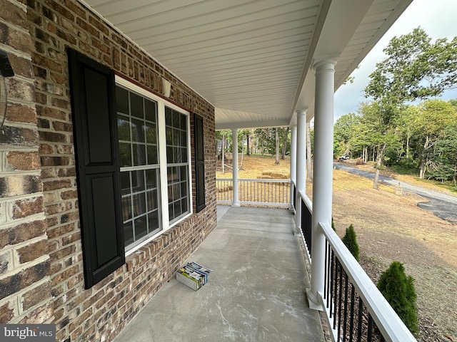 view of patio featuring a porch