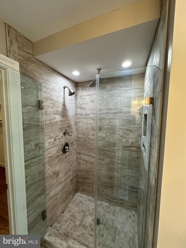 bathroom featuring an enclosed shower