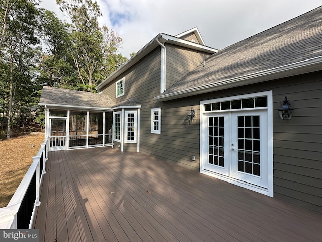 wooden deck featuring french doors and a sunroom