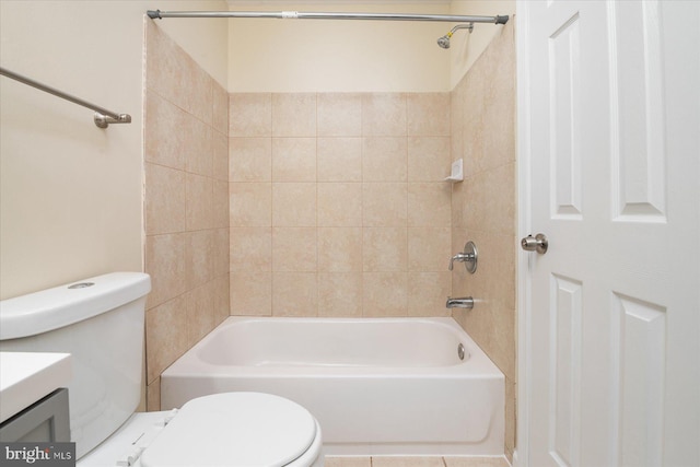 full bathroom with vanity, toilet, and tiled shower / bath