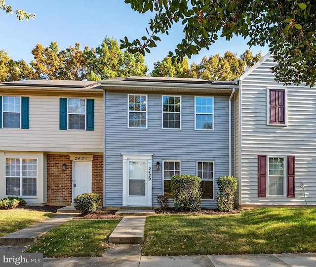 view of property with a front lawn