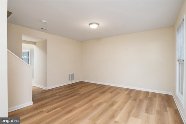 empty room with light hardwood / wood-style floors