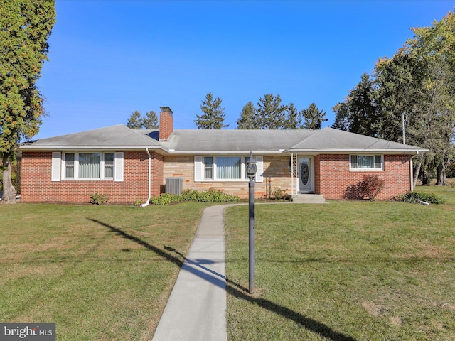 single story home with cooling unit and a front lawn