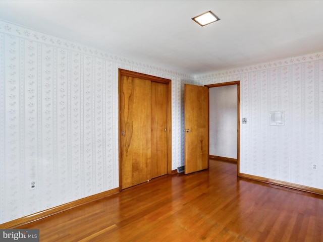 unfurnished bedroom featuring wood-type flooring