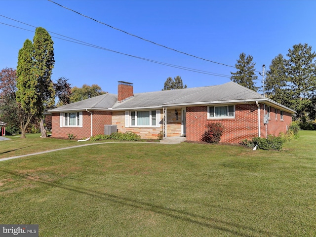 ranch-style home with cooling unit and a front lawn