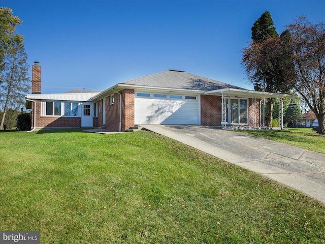 ranch-style house featuring a front lawn and a garage