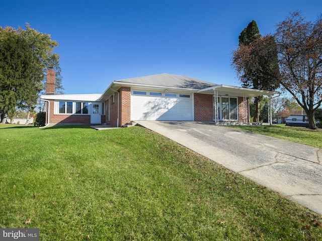 ranch-style home with a front yard and a garage