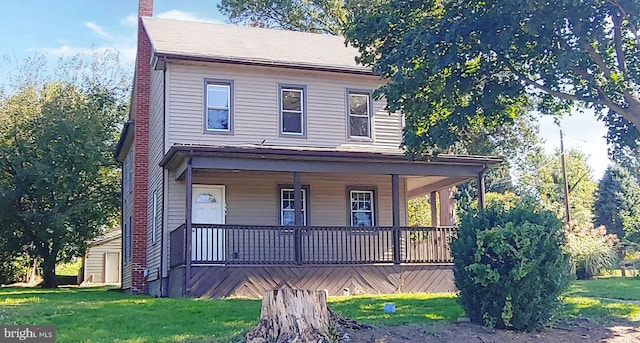 view of front of house with a front lawn and covered porch