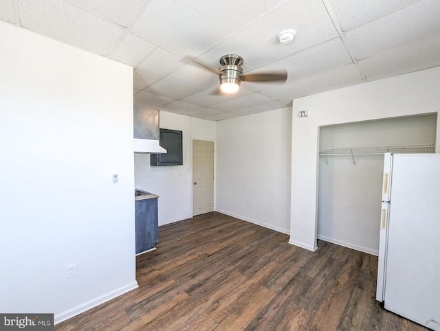 5200 Ballman, Brooklyn, MD 21225 - unfurnished bedroom with a drop ceiling, dark wood-type flooring, and freestanding refrigerator