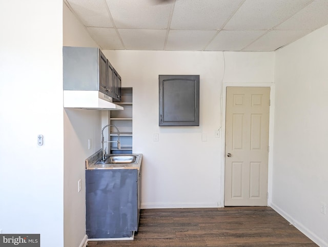 5200 Ballman, Brooklyn, MD 21225 - kitchen with dark wood-type flooring, a drop ceiling, light countertops, and a sink