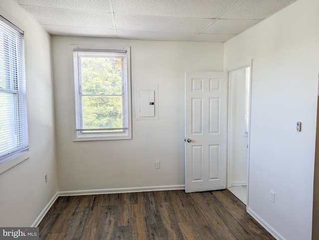 5200 Ballman, Brooklyn, MD 21225 - unfurnished room with dark wood-style floors, electric panel, a drop ceiling, and baseboards