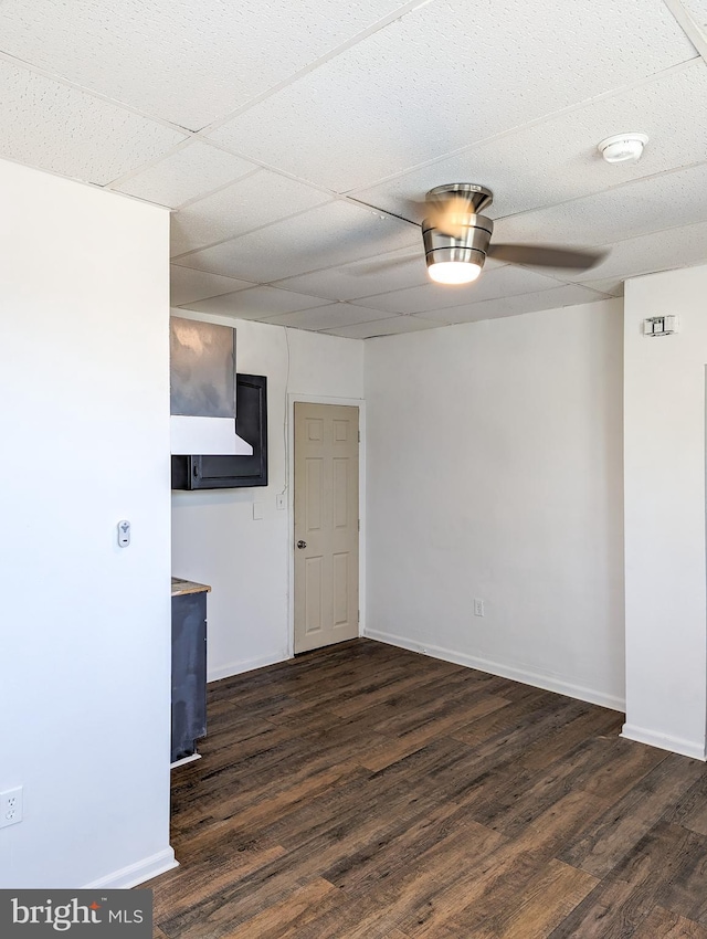 5200 Ballman, Brooklyn, MD 21225 - unfurnished room with dark wood-style floors, baseboards, and a ceiling fan