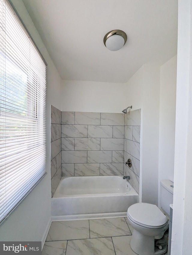 5200 Ballman, Brooklyn, MD 21225 - bathroom featuring bathtub / shower combination, toilet, marble finish floor, and baseboards