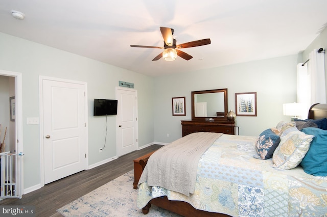 bedroom featuring dark hardwood / wood-style floors and ceiling fan