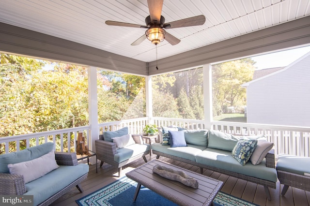 sunroom with a wealth of natural light and ceiling fan