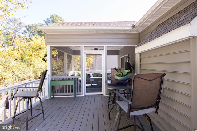 wooden terrace featuring a sunroom