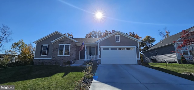 view of front of house featuring a front lawn and a garage