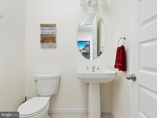 bathroom featuring toilet and sink