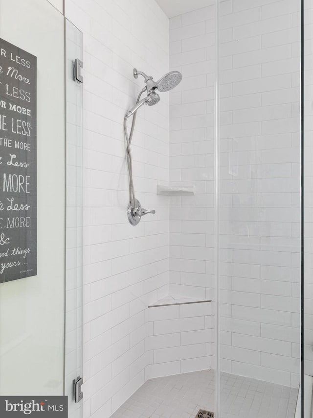 bathroom with a shower with shower door