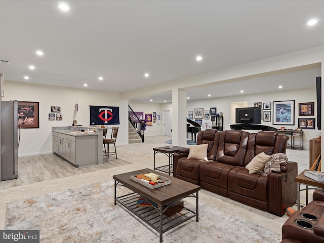 living room with light hardwood / wood-style flooring