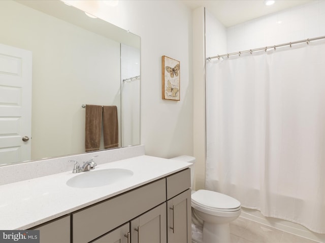 full bathroom featuring vanity, shower / tub combo, toilet, and tile patterned flooring