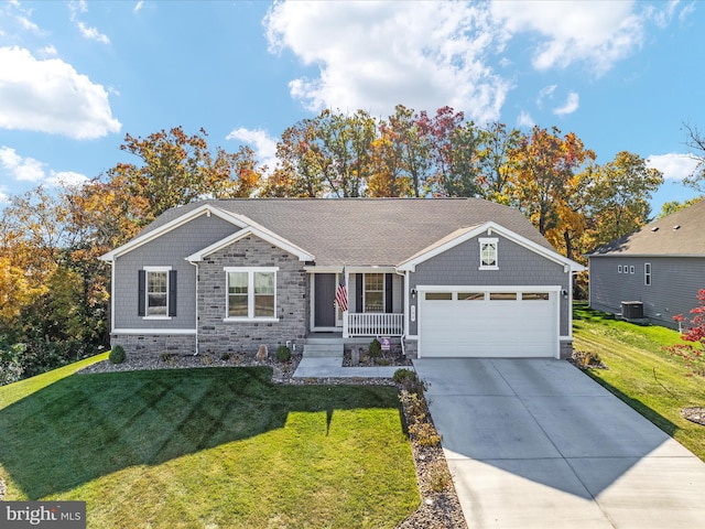 single story home with central AC, a front yard, a garage, and covered porch