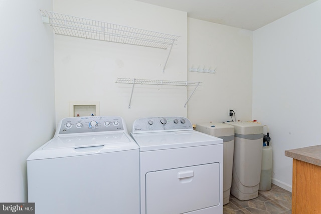 washroom with washing machine and clothes dryer