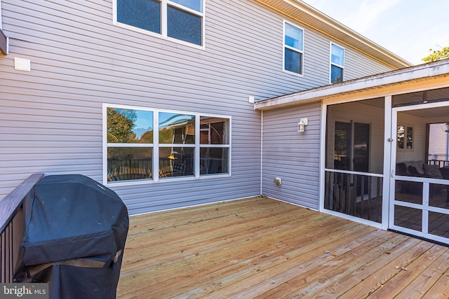 wooden deck with area for grilling