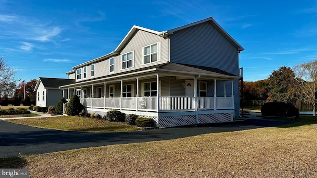 view of front of property with a front lawn and a porch