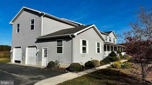 view of side of home with a garage