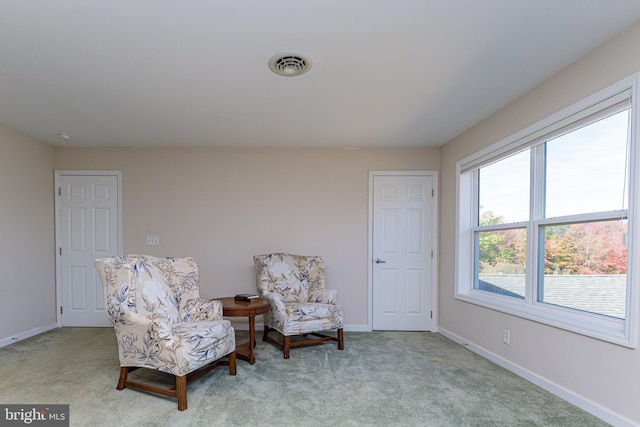 sitting room with light carpet