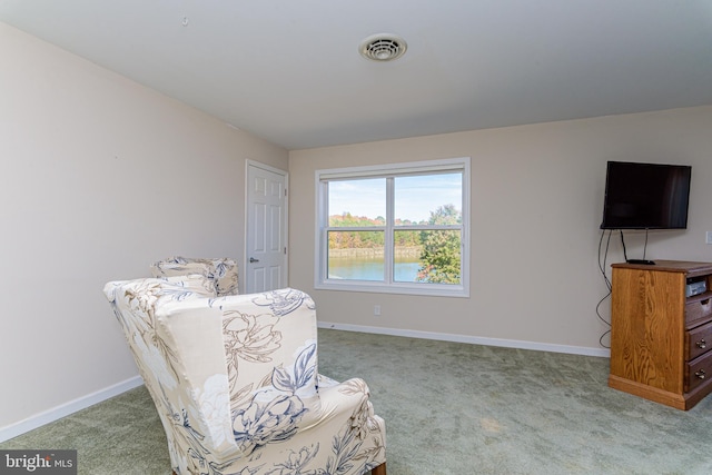 living area featuring carpet