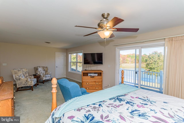 carpeted bedroom with ceiling fan and access to exterior