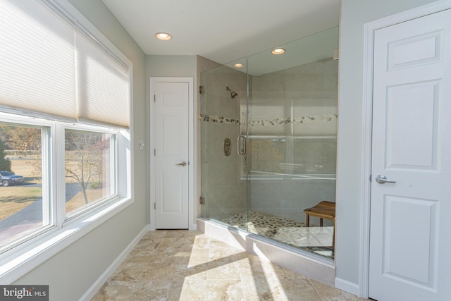 bathroom with a shower with shower door