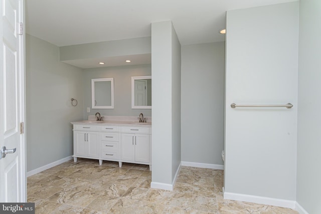 bathroom featuring toilet and vanity