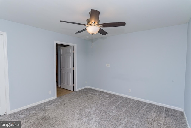 empty room with light carpet and ceiling fan