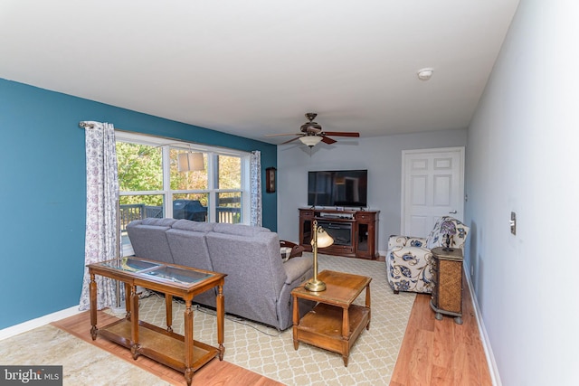 living room featuring hardwood / wood-style flooring and ceiling fan